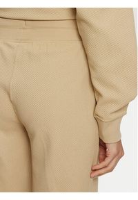Puma Spodnie dresowe Her 676007 Beżowy Relaxed Fit. Kolor: beżowy. Materiał: bawełna, syntetyk #3