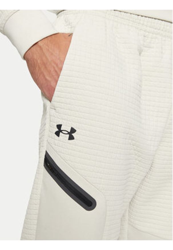 Under Armour Spodnie dresowe UA Unstoppable 1386544 Écru Regular Fit. Materiał: syntetyk