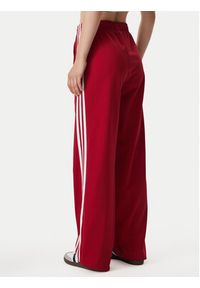 Adidas - adidas Spodnie dresowe Firebird Loose Tracksuit KS4670 Czerwony Loose Fit. Kolor: czerwony. Materiał: syntetyk #4