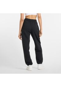 Spodnie damskie New Balance WP51500BK – czarne. Stan: podwyższony. Kolor: czarny. Materiał: bawełna, dresówka, poliester #4