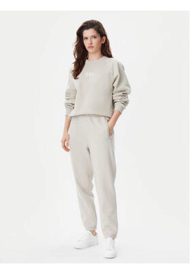 GAP - Gap Spodnie dresowe 765568-03 Beżowy Relaxed Fit. Kolor: beżowy. Materiał: bawełna