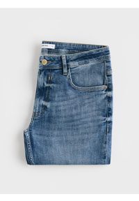 Reserved - Jeansy slim z efektem sprania - niebieski. Kolor: niebieski