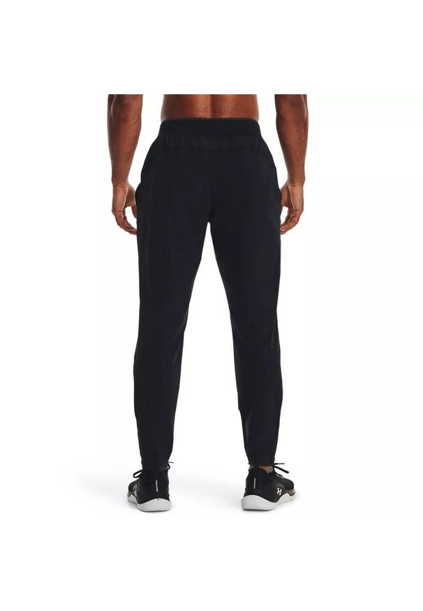 Spodnie dresowe męskie Under Armour STORM RUN PANT. Kolor: czarny. Materiał: dresówka. Sport: bieganie
