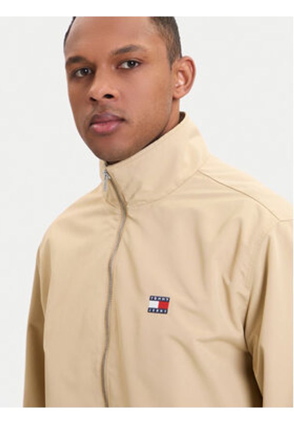 Tommy Jeans Kurtka przejściowa Essential DM0DM22720 Beżowy Regular Fit. Kolor: beżowy. Materiał: syntetyk