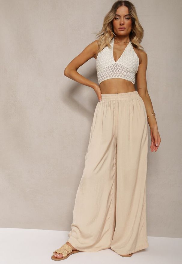 Renee - Jasnobeżowe Spodnie High Wiast z Wiskozą i Szerokimi Nogawkami Osevia. Okazja: do pracy. Stan: podwyższony. Kolor: beżowy. Materiał: wiskoza. Styl: elegancki
