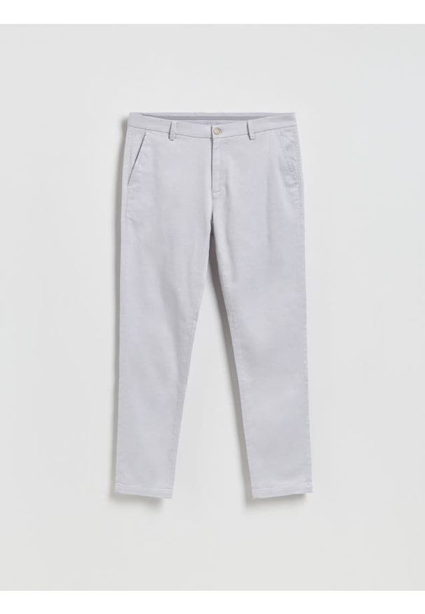 Reserved - Spodnie chino slim - lawendowy. Kolor: fioletowy. Materiał: tkanina, bawełna