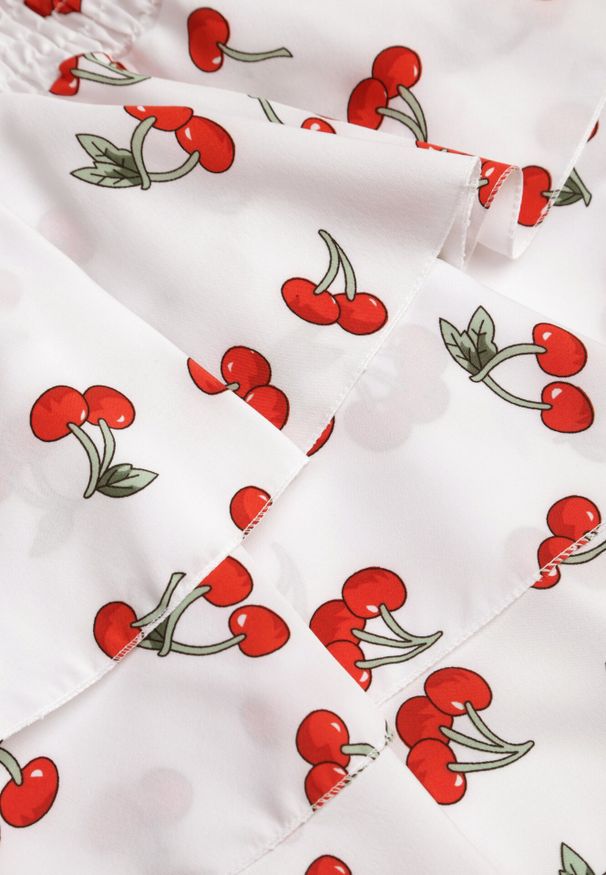 Born2be - Biała Rozkloszowana Sukienka w Wisienki z Falbankami i Dekoltem Halter Lanideia. Okazja: na imprezę, na co dzień, na spacer. Typ kołnierza: dekolt halter, kołnierz z falbankami. Kolor: biały. Materiał: bawełna. Sezon: lato. Typ sukienki: rozkloszowane. Styl: casual