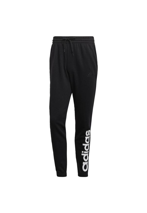 Adidas - Spodnie adidas Essentials Tapered Elastic Cuff Linear. Kolor: czarny. Materiał: bawełna. Sport: fitness