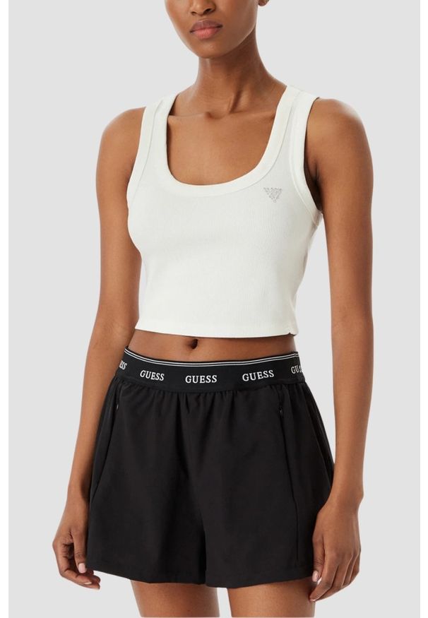 Guess - GUESS Biały krótki damski tank top Silvy Rib, Rozmiar L. Okazja: na co dzień. Kolor: biały. Materiał: materiał, prążkowany. Długość: krótkie. Sezon: lato. Styl: elegancki, casual