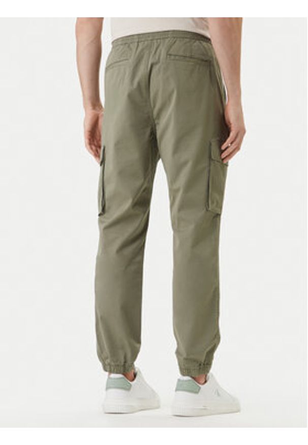 Calvin Klein Jeans Joggery Comfort LV04RD608G Beżowy Skinny Fit. Kolor: beżowy. Materiał: bawełna