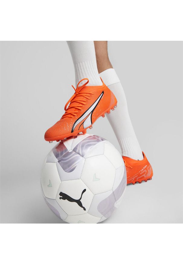 Buty piłkarskie męskie Puma Ultra Match Mg. Zapięcie: sznurówki. Kolor: pomarańczowy. Materiał: materiał. Szerokość cholewki: normalna. Sport: piłka nożna