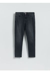Reserved - Jeansy slim fit z efektem sprania - granatowy. Kolor: niebieski