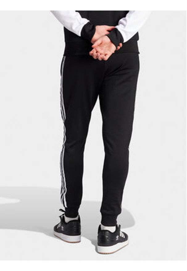 Adidas - adidas Spodnie dresowe adicolor Classics SST IL2488 Czarny Slim Fit. Kolor: czarny. Materiał: bawełna, syntetyk