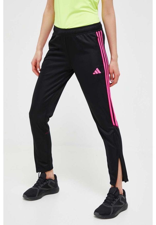 adidas Performance spodnie treningowe Tiro 23 kolor czarny z aplikacją. Kolor: czarny. Materiał: skóra, materiał. Wzór: aplikacja. Sport: fitness