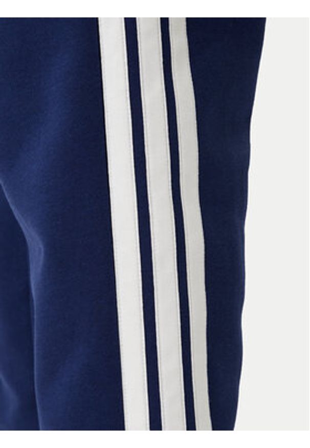 Adidas - adidas Spodnie dresowe Essentials 3-Stripes JE6334 Granatowy Regular Fit. Kolor: niebieski. Materiał: bawełna