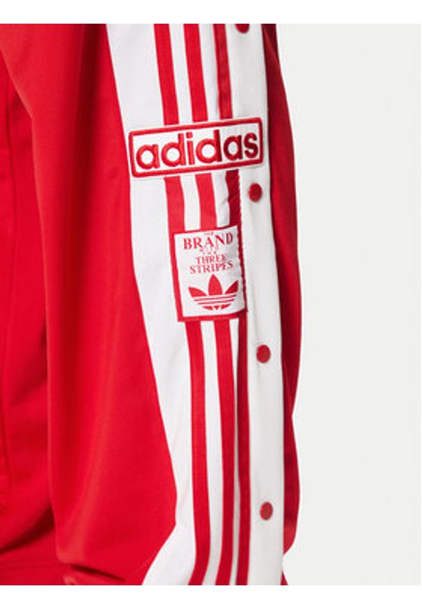 Adidas - adidas Spodnie dresowe Adibreak JP3765 Czerwony Regular Fit. Kolor: czerwony. Materiał: syntetyk