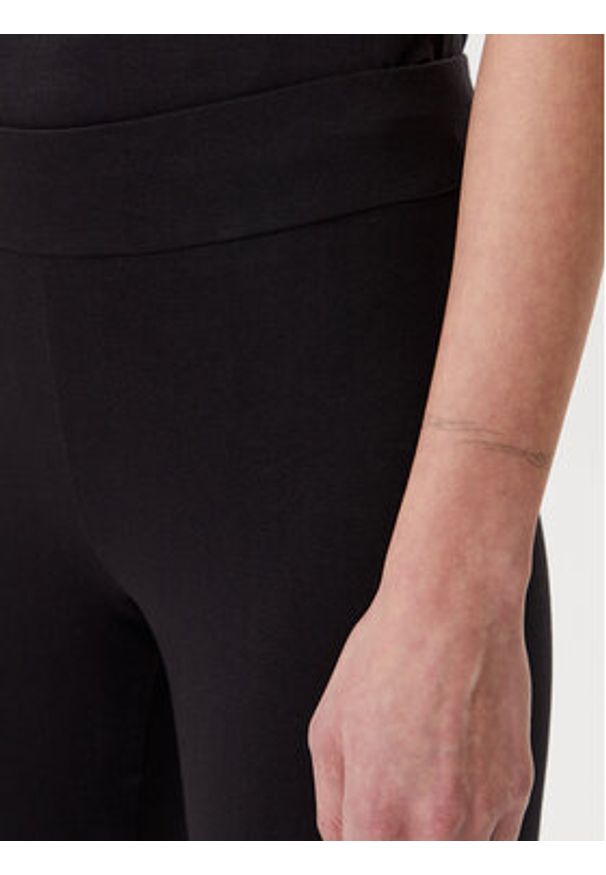 Puma Legginsy Essentials Metallic 685000 Czarny Slim Fit. Kolor: czarny. Materiał: bawełna