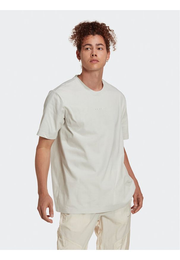 Adidas - adidas T-Shirt Reveal Essentials HK2723 Beżowy Loose Fit. Kolor: beżowy. Materiał: bawełna