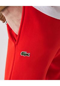 Lacoste - LACOSTE - Czerwone spodnie dresowe Sport Tennis. Kolor: czerwony. Materiał: dresówka. Wzór: haft, aplikacja #3