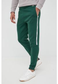 Lacoste spodnie męskie kolor zielony gładkie. Kolor: zielony. Wzór: gładki