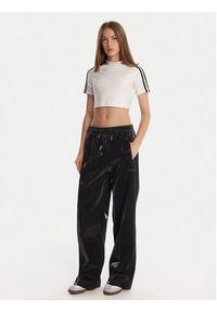 Adidas - adidas Spodnie dresowe adicolor Holiday JV7503 Czarny Loose Fit. Kolor: czarny. Materiał: wiskoza #3