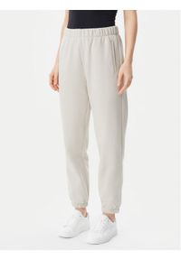 GAP - Gap Spodnie dresowe 765568-03 Beżowy Relaxed Fit. Kolor: beżowy. Materiał: bawełna #1