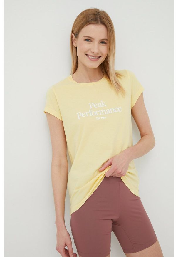 Peak Performance t-shirt bawełniany kolor żółty. Kolor: żółty. Materiał: bawełna. Długość rękawa: krótki rękaw. Długość: krótkie. Wzór: nadruk
