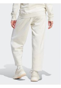 Adidas - adidas Spodnie dresowe Essentials 3-Stripes Open Hem Fleece IM0248 Écru Loose Fit. Materiał: bawełna #4