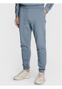 Calvin Klein Spodnie dresowe Logo Tape K10K110820 Szary Regular Fit. Kolor: szary. Materiał: dresówka, syntetyk #1