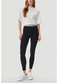 Guess - GUESS Czarne legginsy damskie Aline. Kolor: czarny