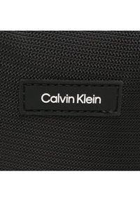 Calvin Klein Saszetka Ck Must T Reporter Xs K50K510570 Czarny. Kolor: czarny. Materiał: materiał