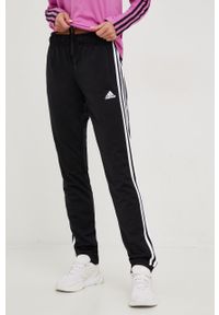 Adidas - adidas spodnie dresowe damskie kolor czarny z aplikacją. Kolor: czarny. Materiał: dresówka. Wzór: aplikacja #1