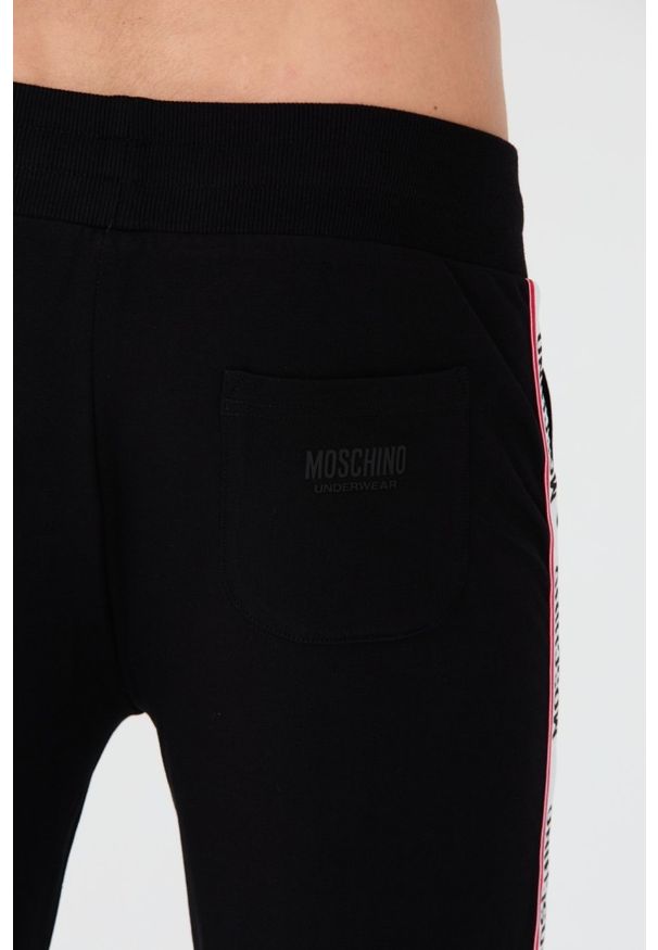 MOSCHINO Czarne męskie spodnie dresowe z lampasami, Rozmiar L. Kolor: czarny. Materiał: dresówka