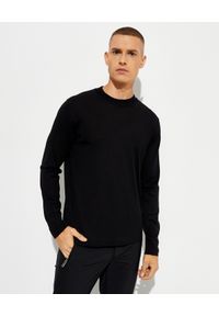 MONCLER - Czarna bluza z dzianiny. Kolor: czarny. Materiał: dzianina. Długość rękawa: długi rękaw. Długość: długie