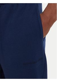 TOMMY HILFIGER - Tommy Hilfiger Spodnie dresowe Essential UM0UM03911 Granatowy Relaxed Fit. Kolor: niebieski. Materiał: bawełna #5
