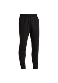 KIPSTA - Spodnie do piłki nożnej Kipsta Essential. Kolor: czarny. Materiał: materiał. Sport: fitness #1