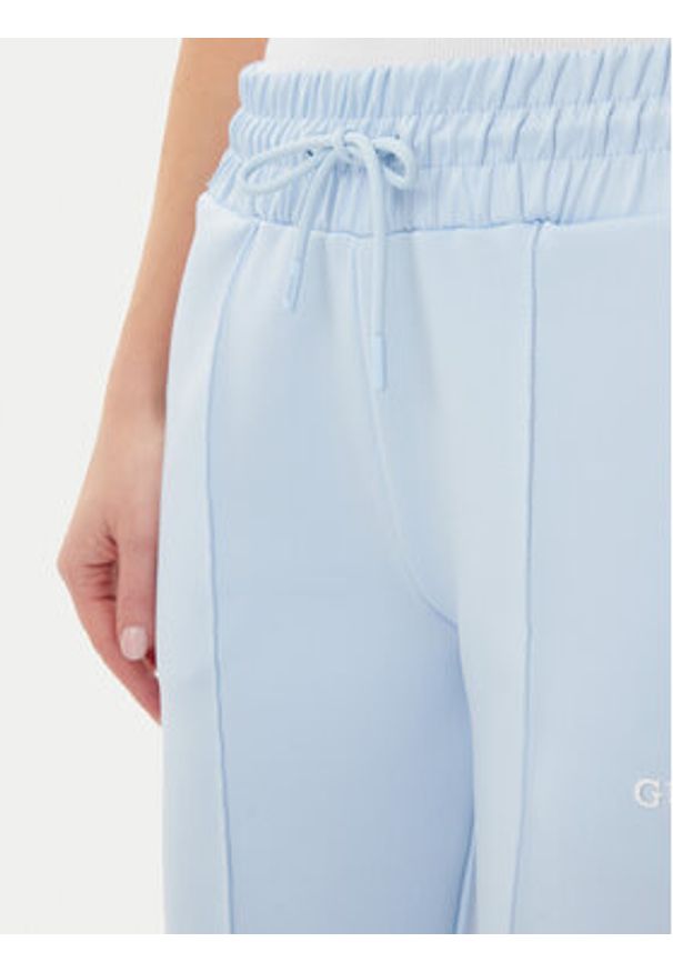 Guess Spodnie dresowe V5GB12 KCRU2 Błękitny Regular Fit. Kolor: niebieski. Materiał: syntetyk