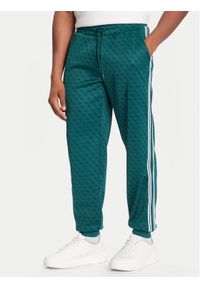 Guess Spodnie dresowe Z5BB19 K2042 Zielony Regular Fit. Kolor: zielony. Materiał: syntetyk