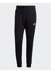 Adidas - adidas Spodnie dresowe Essentials Fleece Regular Tapered Joggers HL2236 Czarny Regular Fit. Kolor: czarny. Materiał: bawełna