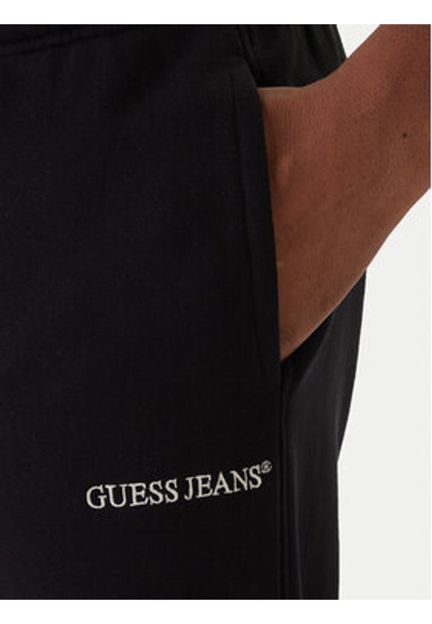Guess Jeans Spodnie dresowe M6RB70 KCPR1 Czarny Regular Fit. Kolor: czarny. Materiał: bawełna