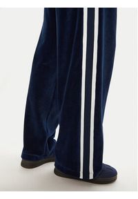 Tommy Jeans Spodnie dresowe Velvet DW0DW20542 Niebieski Regular Fit. Kolor: niebieski. Materiał: bawełna