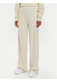 Guess Spodnie dzianinowe O4BB02 KCHZ2 Beżowy Relaxed Fit. Kolor: beżowy. Materiał: bawełna