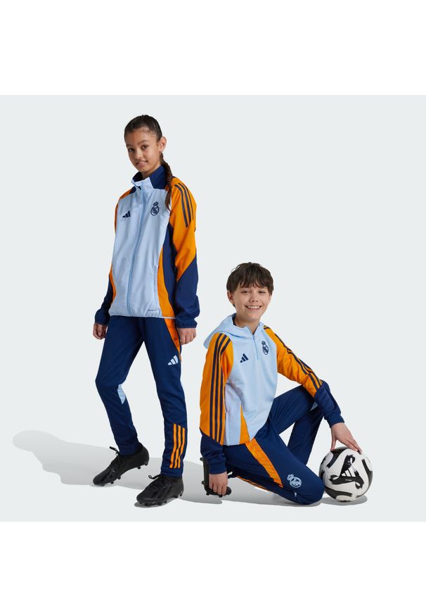 Adidas - Spodnie Real Madrid Tiro 24 Competition Training Kids. Kolor: niebieski, pomarańczowy, wielokolorowy. Materiał: materiał. Sport: fitness