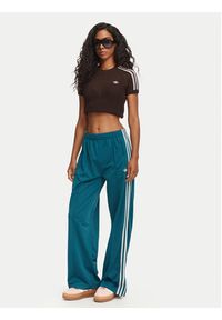 Adidas - adidas Spodnie dresowe Firebird Loose Tracksuit KS4672 Turkusowy Loose Fit. Kolor: turkusowy. Materiał: syntetyk #3