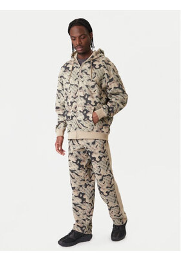 Guess Spodnie dresowe Z6RB02 K9YI1 Beżowy Regular Fit. Kolor: beżowy. Materiał: bawełna