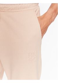 Hugo Spodnie dresowe Dchard 50496652 Beżowy Relaxed Fit. Kolor: beżowy. Materiał: bawełna, dresówka