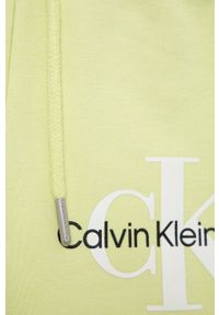 Calvin Klein Jeans szorty dziecięce kolor zielony z nadrukiem. Kolor: zielony. Materiał: materiał. Wzór: nadruk