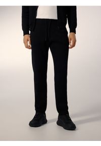 Reserved - Dzianinowe spodnie jogger - czarny. Kolor: czarny. Materiał: dzianina #1