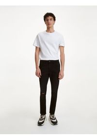 Reserved - Jeansy skinny z dziurami - czarny. Kolor: czarny #1