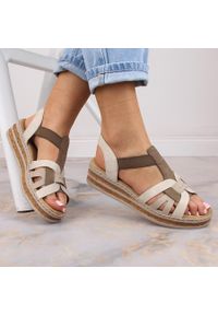 Komfortowe sandały damskie na koturnie beżowe Rieker 62918-62. Kolor: beżowy. Materiał: skóra ekologiczna. Obcas: na koturnie #1